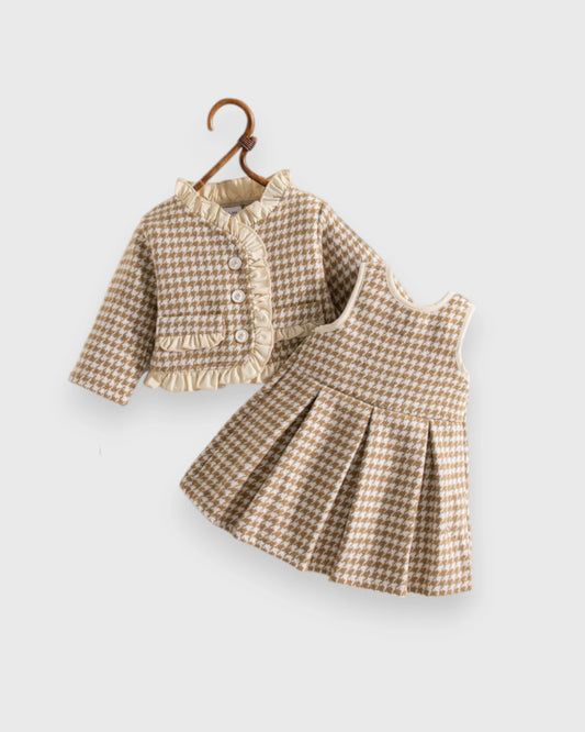 Baby girls' beige houndstooth jacket and pleated dress with cream ruffled trim.