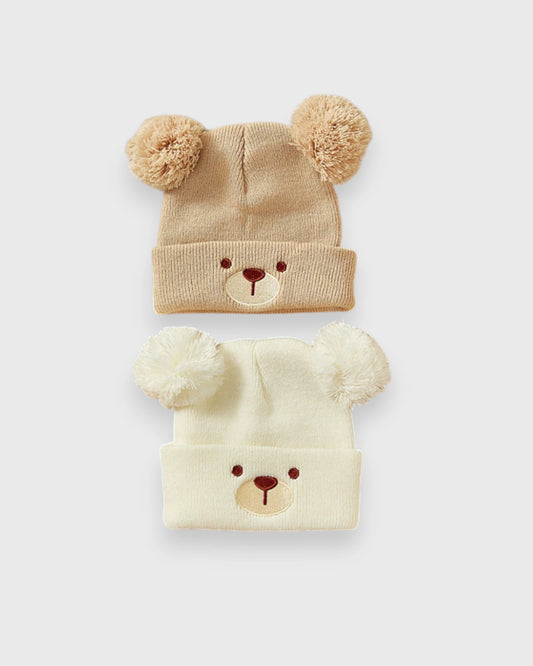 Tan and cream baby bear-face knit hats with pom-pom ears
